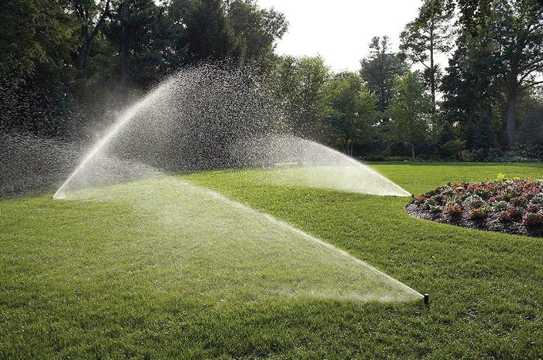Residential irrigation system providing engineered multi-zone coverage across a manicured Houston-area lawn